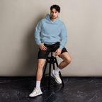 Carolina Blue oversized hoodie editorial lifestyle worn by model sitting – The Pixel Wolf