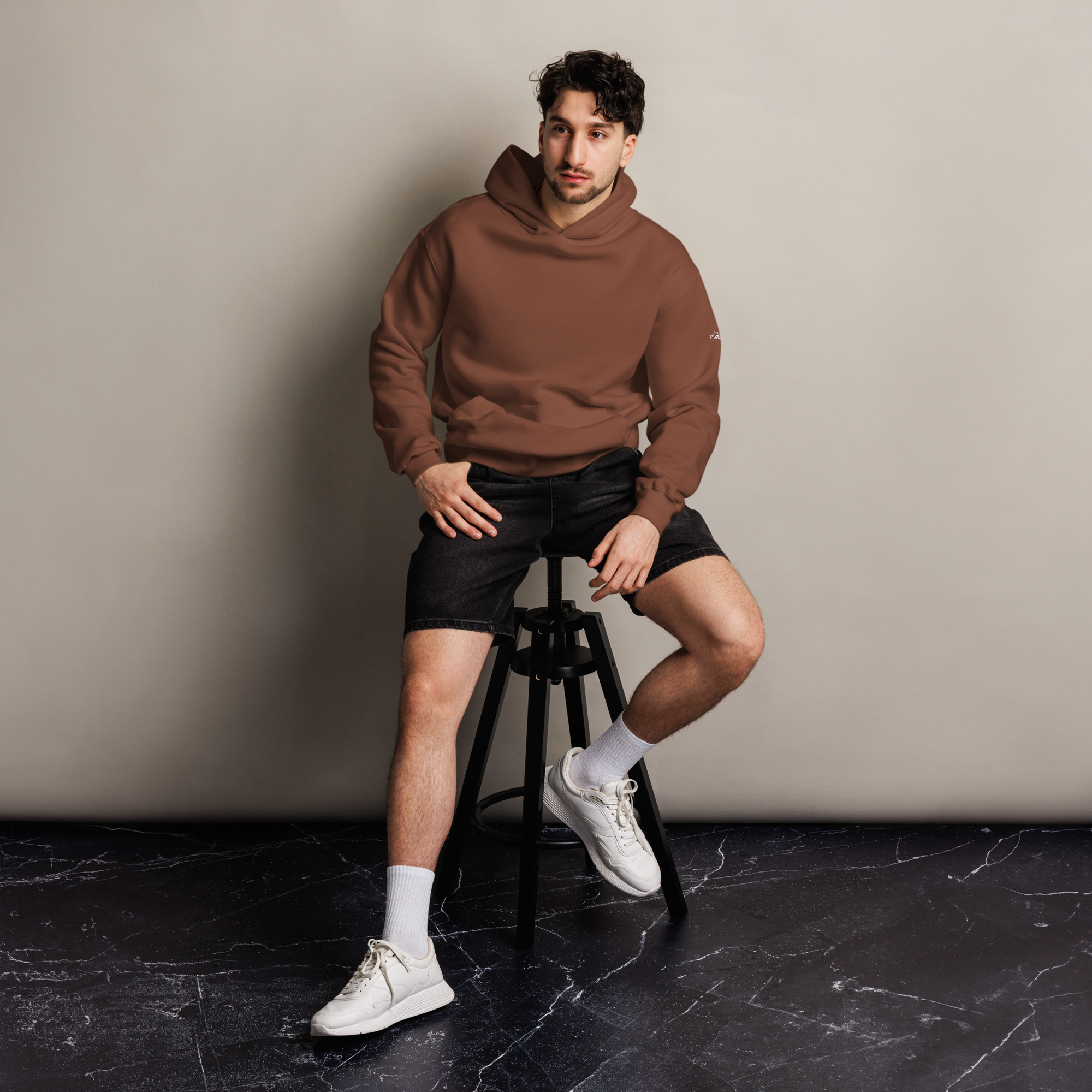 Chestnut oversized hoodie editorial lifestyle worn by model sitting – The Pixel Wolf