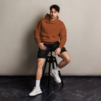 Clay oversized hoodie editorial lifestyle worn by model sitting – The Pixel Wolf