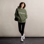 Cypress oversized hoodie worn by woman, relaxed streetwear fit with “CREATE with PURPOSE” print