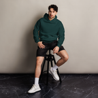 Pine Green oversized hoodie editorial lifestyle worn by model sitting – The Pixel Wolf