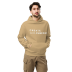 Sand oversized hoodie worn by man, oversized silhouette with “CREATE with PURPOSE” print