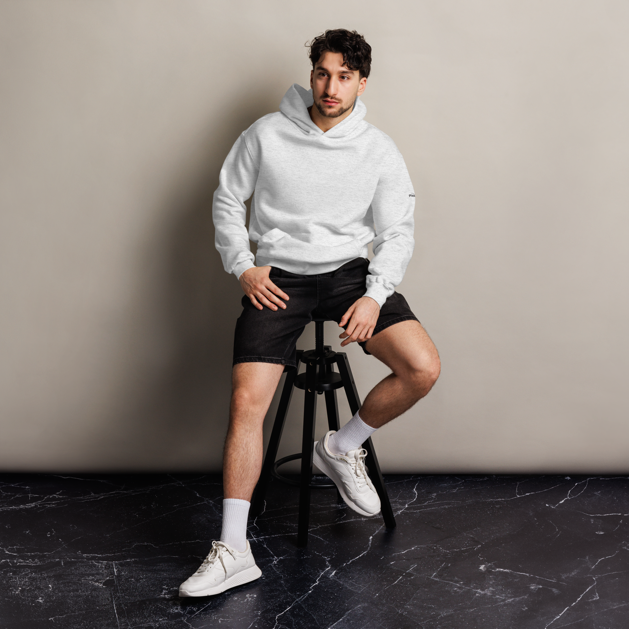 White Heather oversized hoodie editorial lifestyle worn by model sitting – The Pixel Wolf