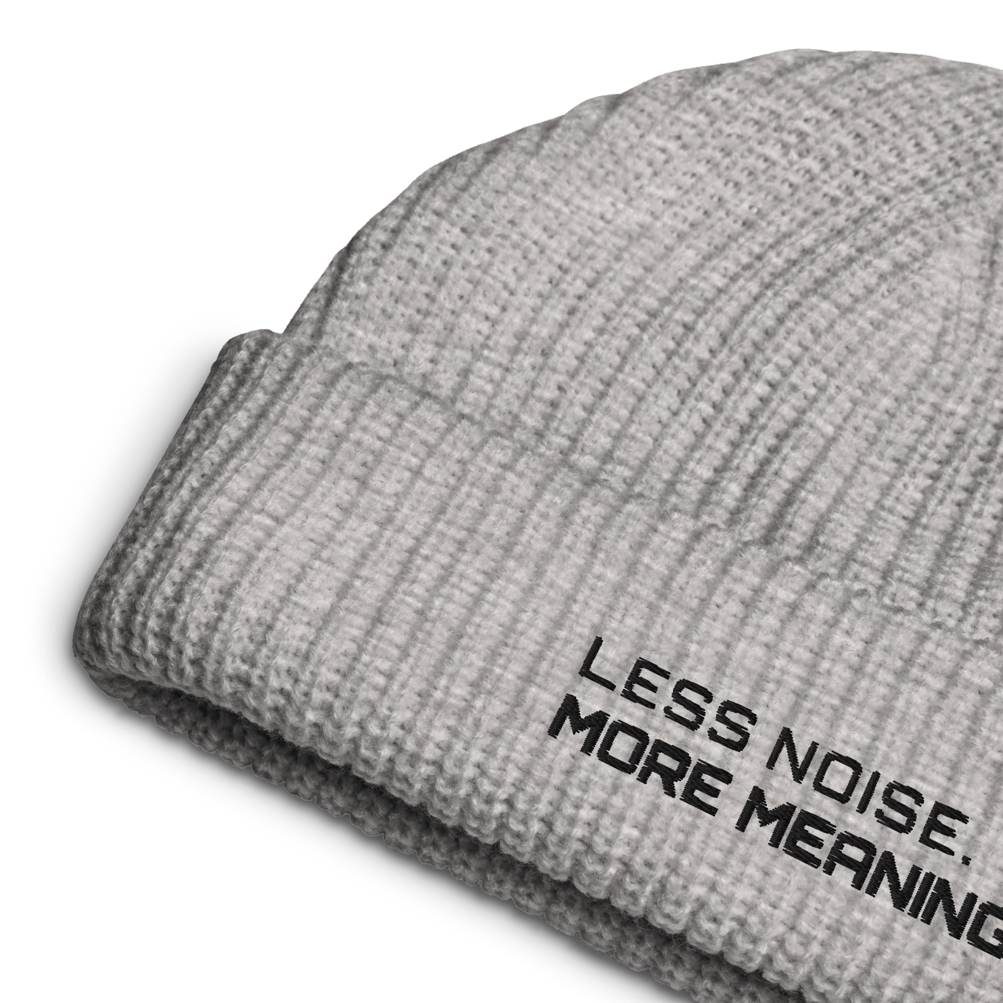 Athletic Heather fisherman beanie close-up showing embroidered Less Noise More Meaning slogan