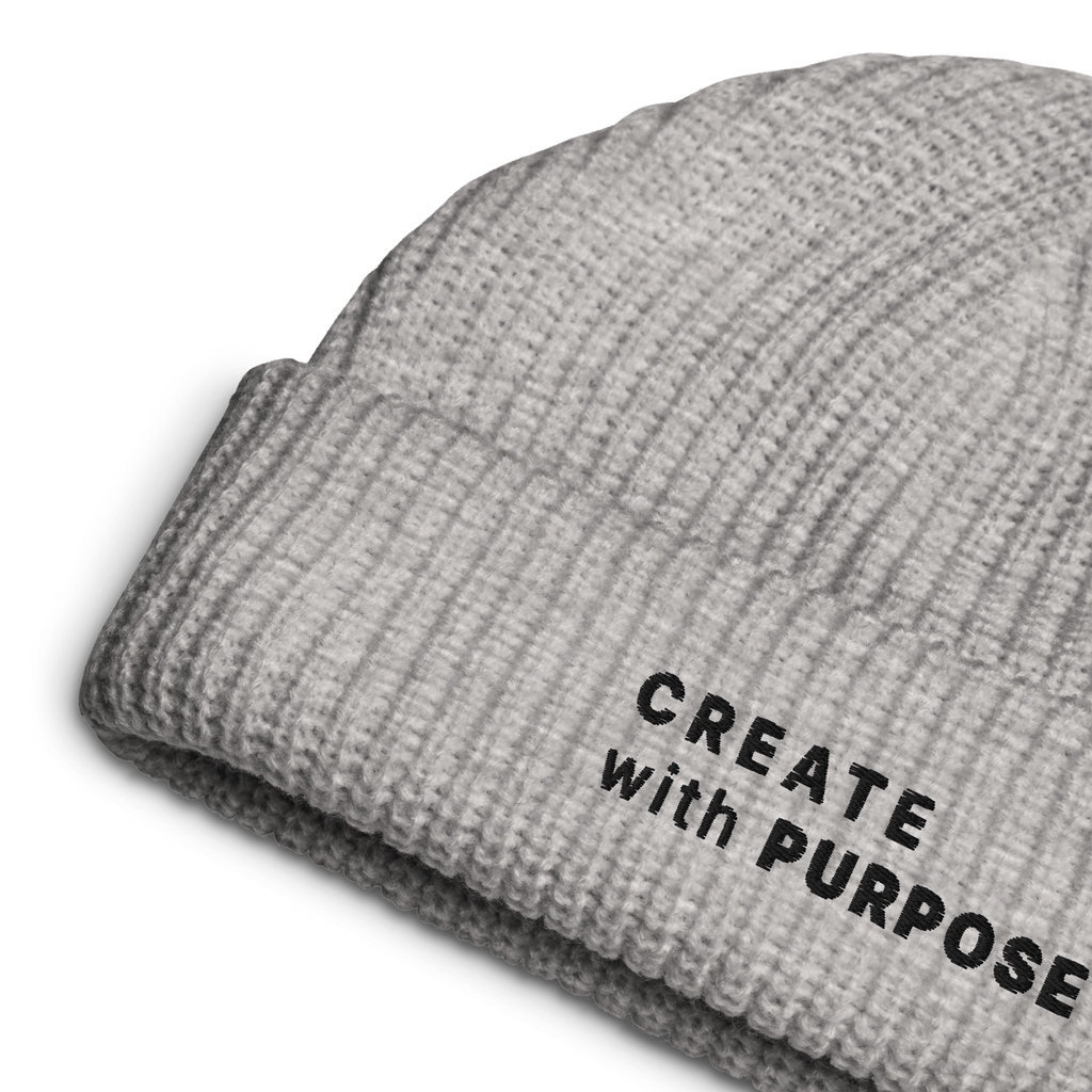 Athletic Heather ribbed knit fisherman beanie detail showing “CREATE WITH PURPOSE” embroidery – The Pixel Wolf
