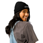 Black fisherman beanie worn in lifestyle setting with minimalist outfit