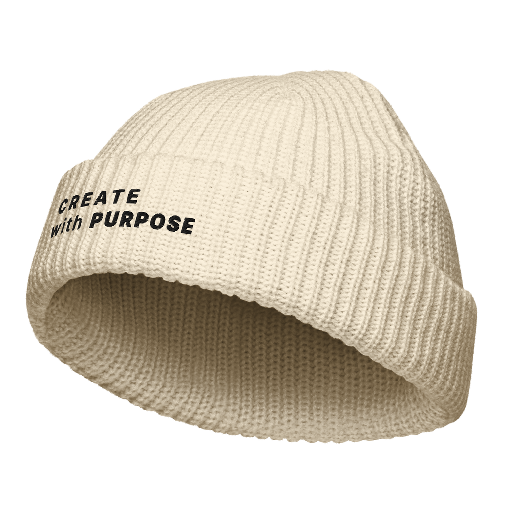 Ecru fisherman beanie angled view with “CREATE WITH PURPOSE” embroidery – The Pixel Wolf