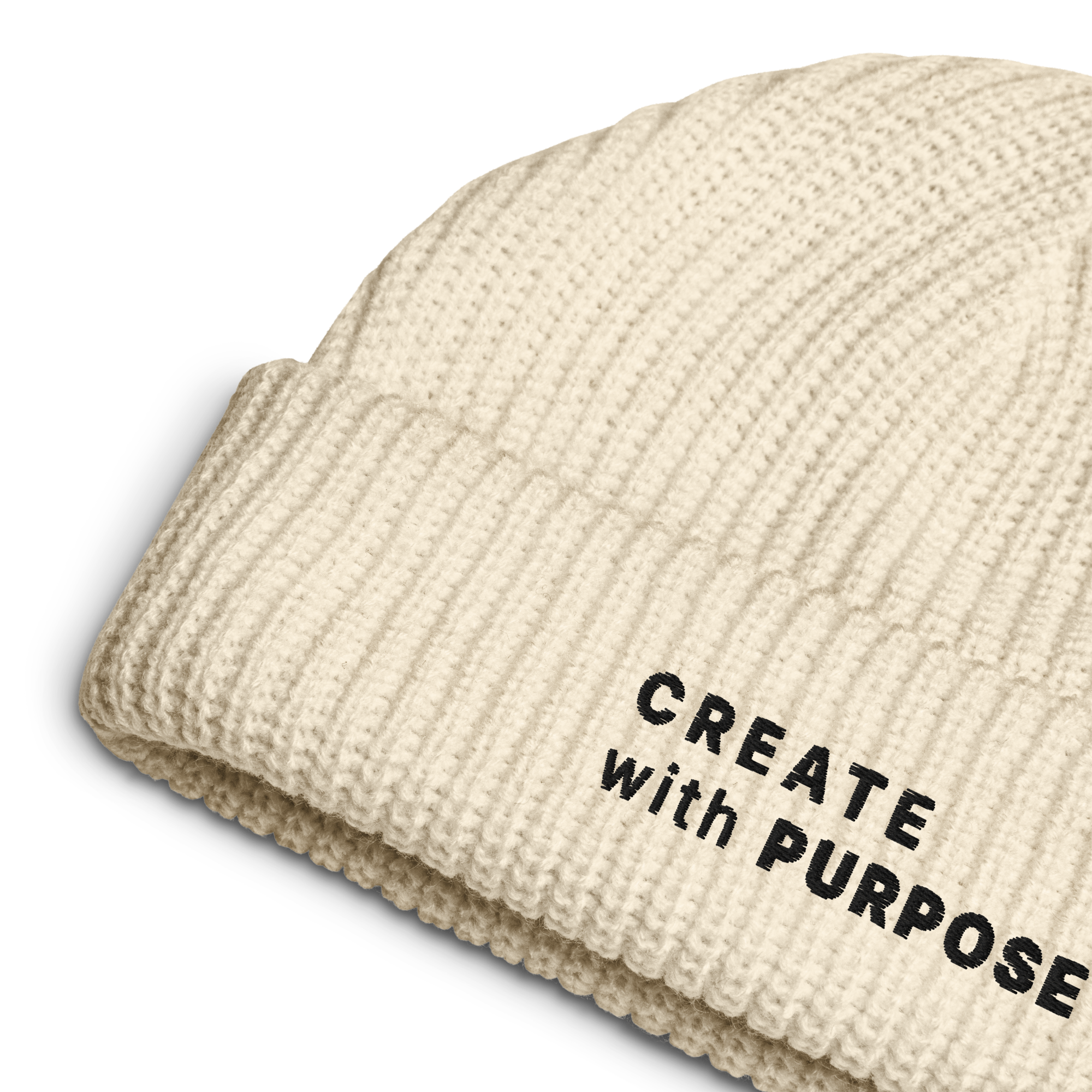 Ecru ribbed knit fisherman beanie detail showing “CREATE WITH PURPOSE” embroidery – The Pixel Wolf