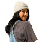 Ecru fisherman beanie worn in lifestyle setting with minimalist outfit