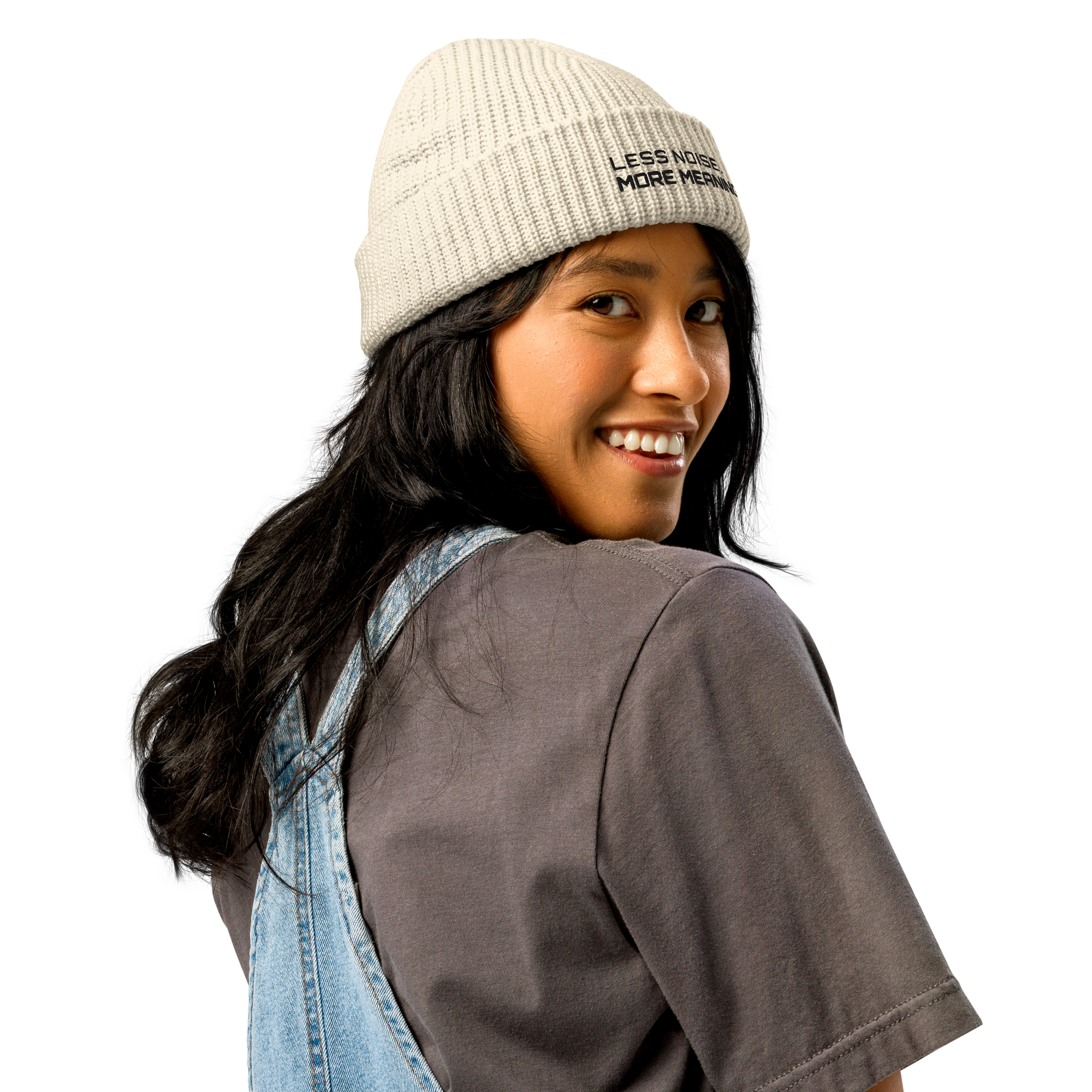 Ecru fisherman beanie worn in lifestyle setting with minimalist outfit