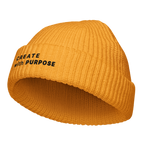 Gold fisherman beanie angled view with “CREATE WITH PURPOSE” embroidery – The Pixel Wolf