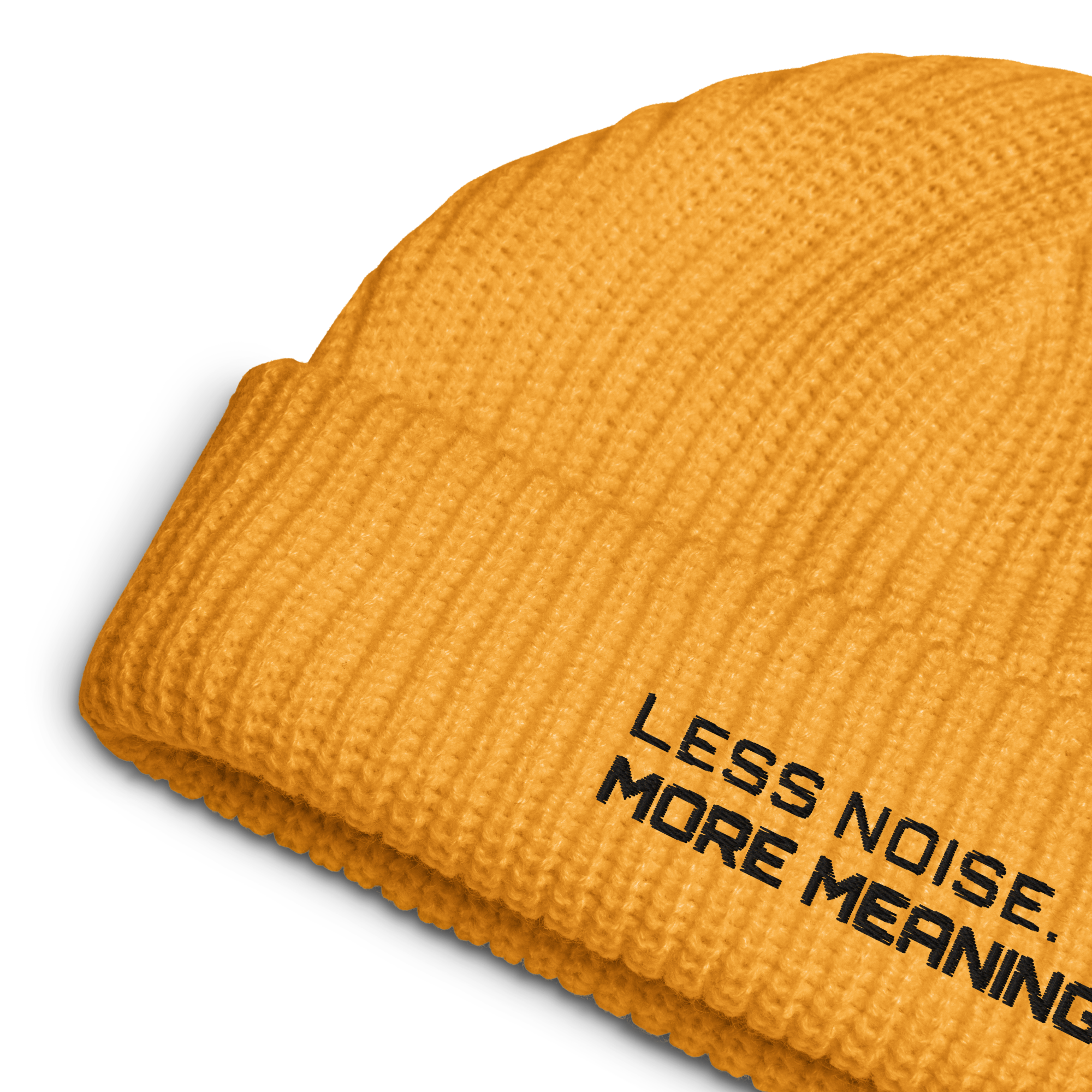 Gold fisherman beanie close-up showing embroidered Less Noise More Meaning slogan
Gold fisherman beanie worn in lifestyle setting with minimalist outfit