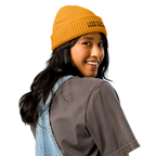 Gold fisherman beanie worn in lifestyle setting with minimalist outfit