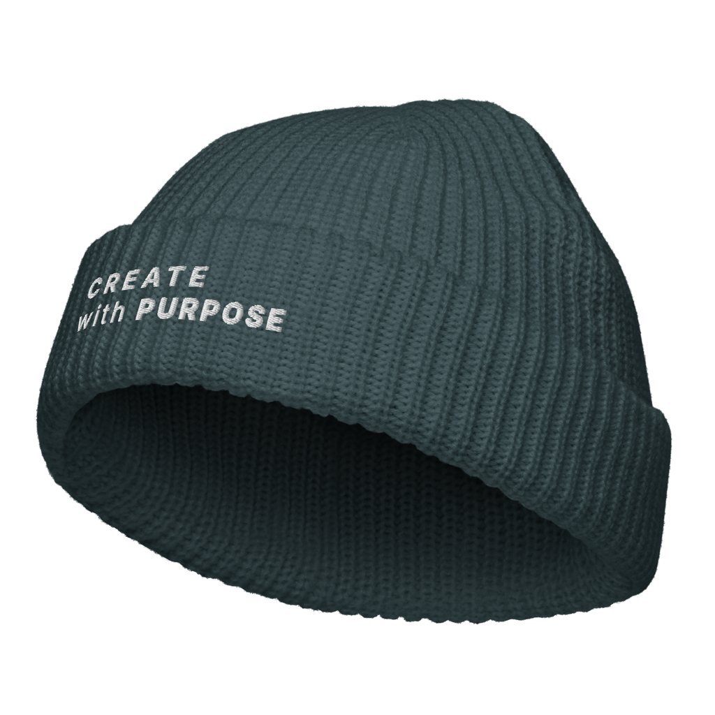 Petrol Blue fisherman beanie angled view with “CREATE WITH PURPOSE” embroidery – The Pixel Wolf