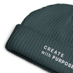 Petrol Blue ribbed knit fisherman beanie detail showing “CREATE WITH PURPOSE” embroidery – The Pixel Wolf