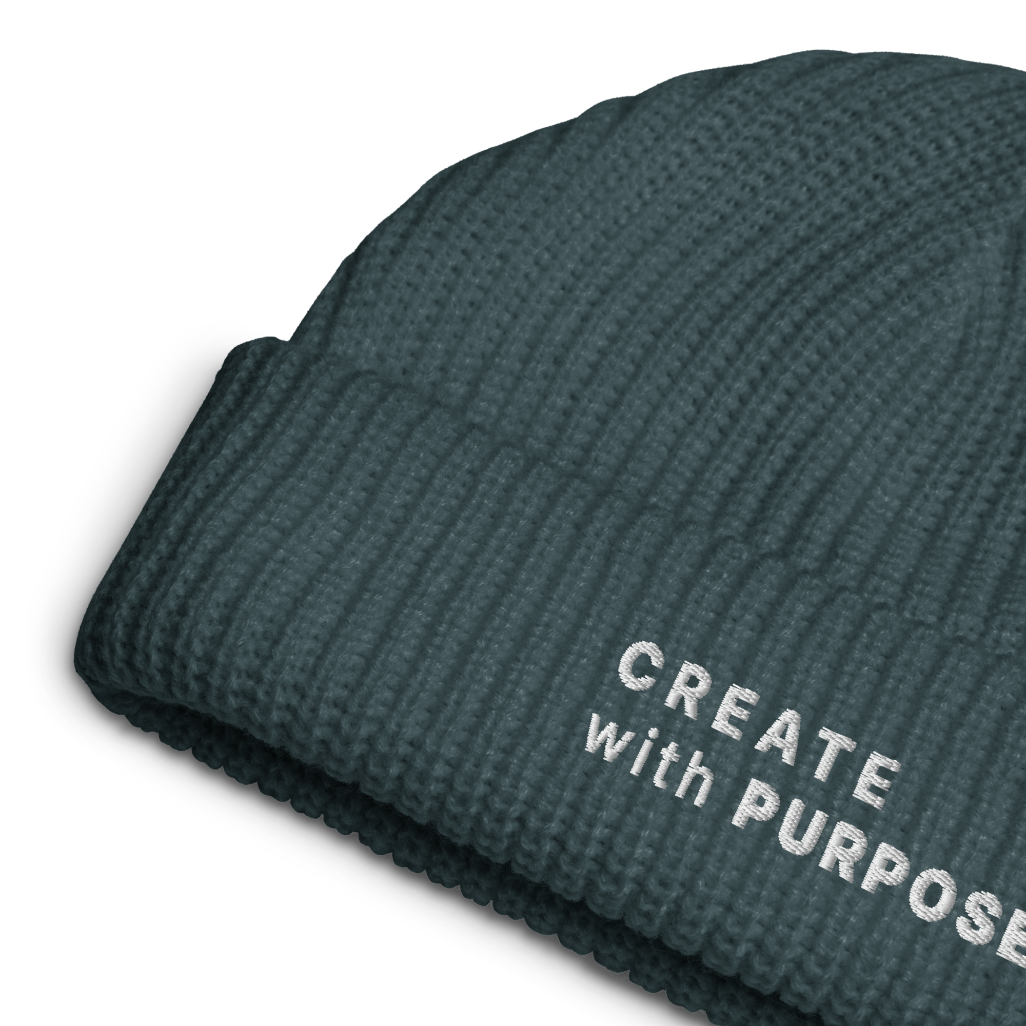 Petrol Blue ribbed knit fisherman beanie detail showing “CREATE WITH PURPOSE” embroidery – The Pixel Wolf