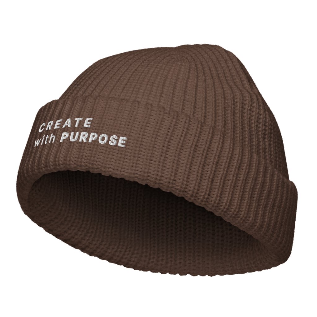 Walnut fisherman beanie angled view with “CREATE WITH PURPOSE” embroidery – The Pixel Wolf