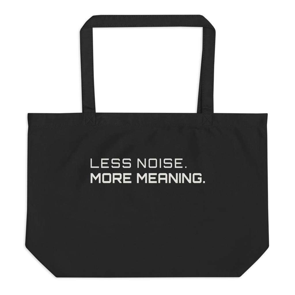 Black large organic tote bag front view with “Less Noise More Meaning” print – The Pixel Wolf
