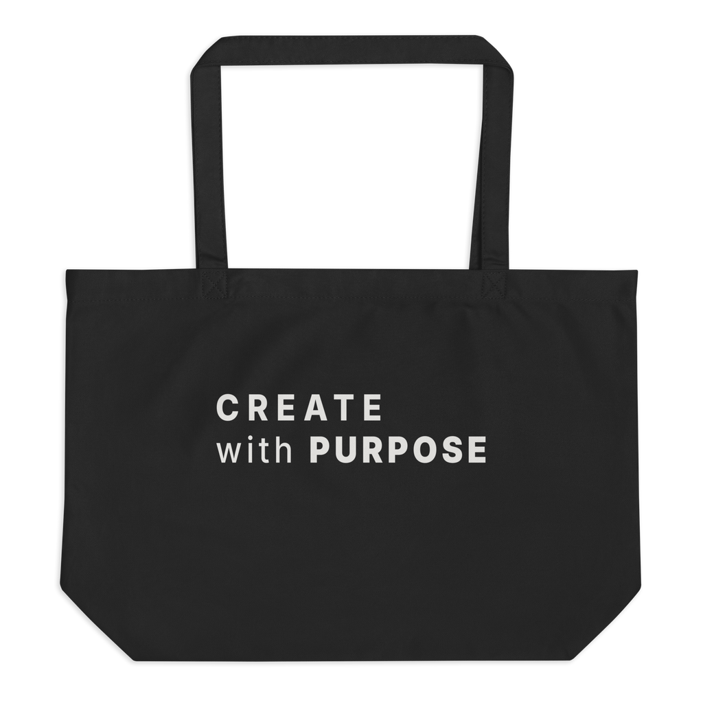 Black large organic tote bag with “CREATE WITH PURPOSE” printed on the front