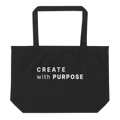 Black large organic tote bag with “CREATE WITH PURPOSE” printed on the front
