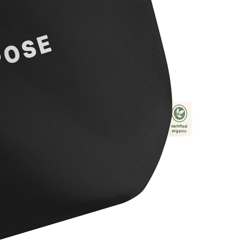 Black organic cotton tote bag detail showing print and fabric texture