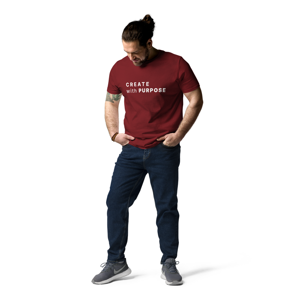 Burgundy organic cotton t-shirt lifestyle photo of man wearing “CREATE with PURPOSE”