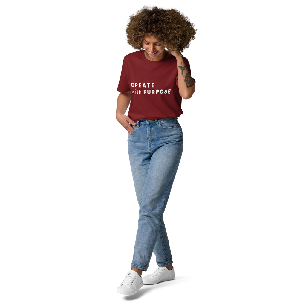 Burgundy organic cotton t-shirt lifestyle photo of woman wearing “CREATE with PURPOSE”