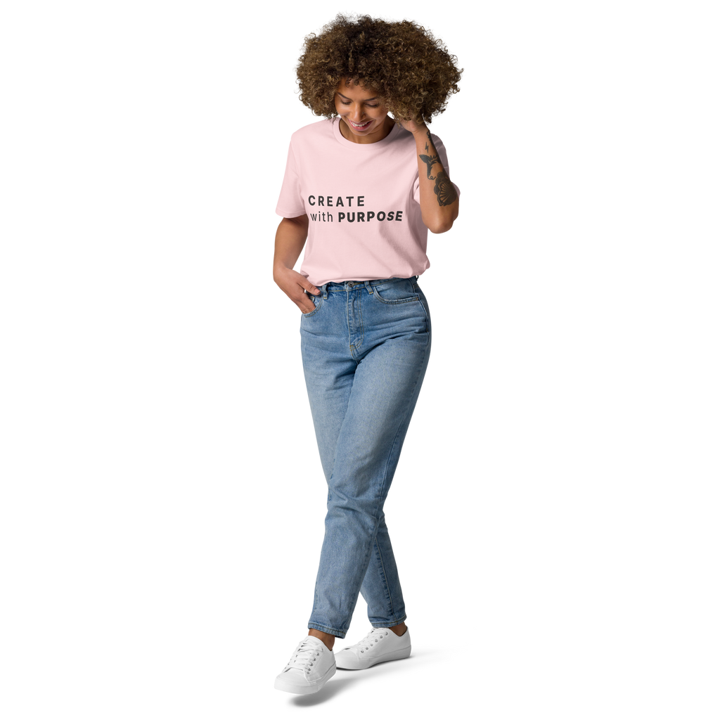 Cotton Pink organic cotton t-shirt lifestyle photo of woman wearing “CREATE with PURPOSE”