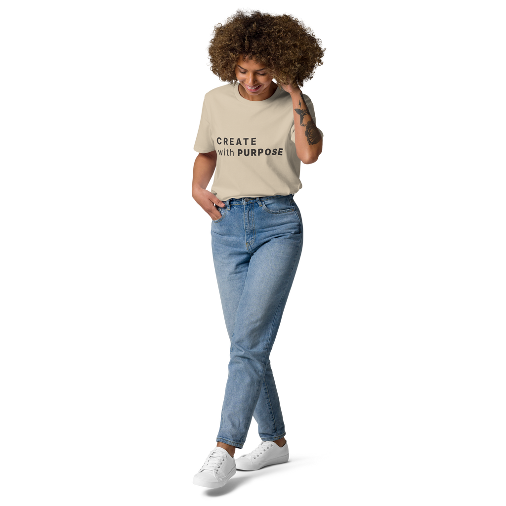 Desert Dust organic cotton t-shirt lifestyle photo of woman wearing “CREATE with PURPOSE”