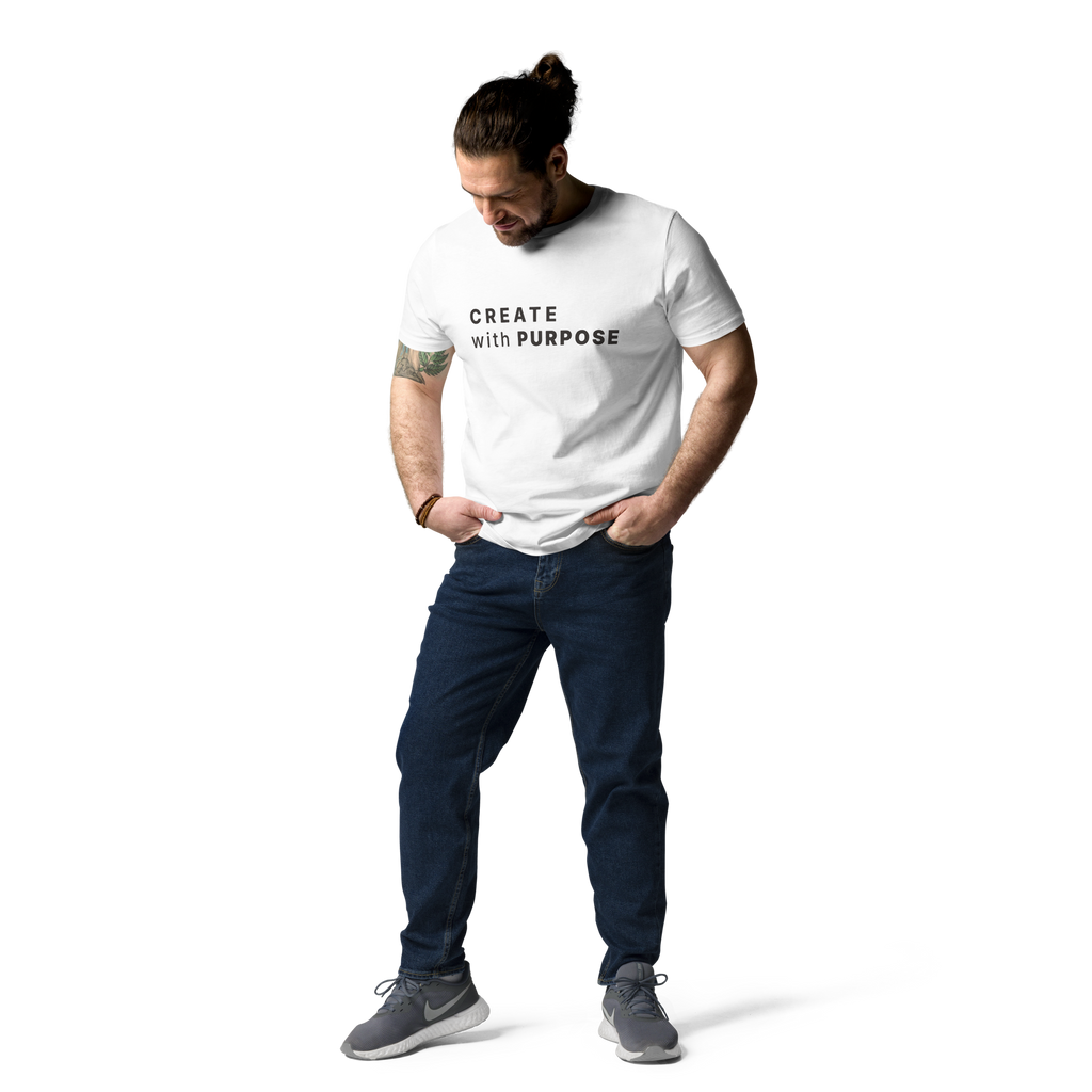 White organic cotton t-shirt lifestyle photo of man wearing “CREATE with PURPOSE”