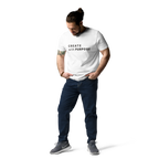 White organic cotton t-shirt lifestyle photo of man wearing “CREATE with PURPOSE”