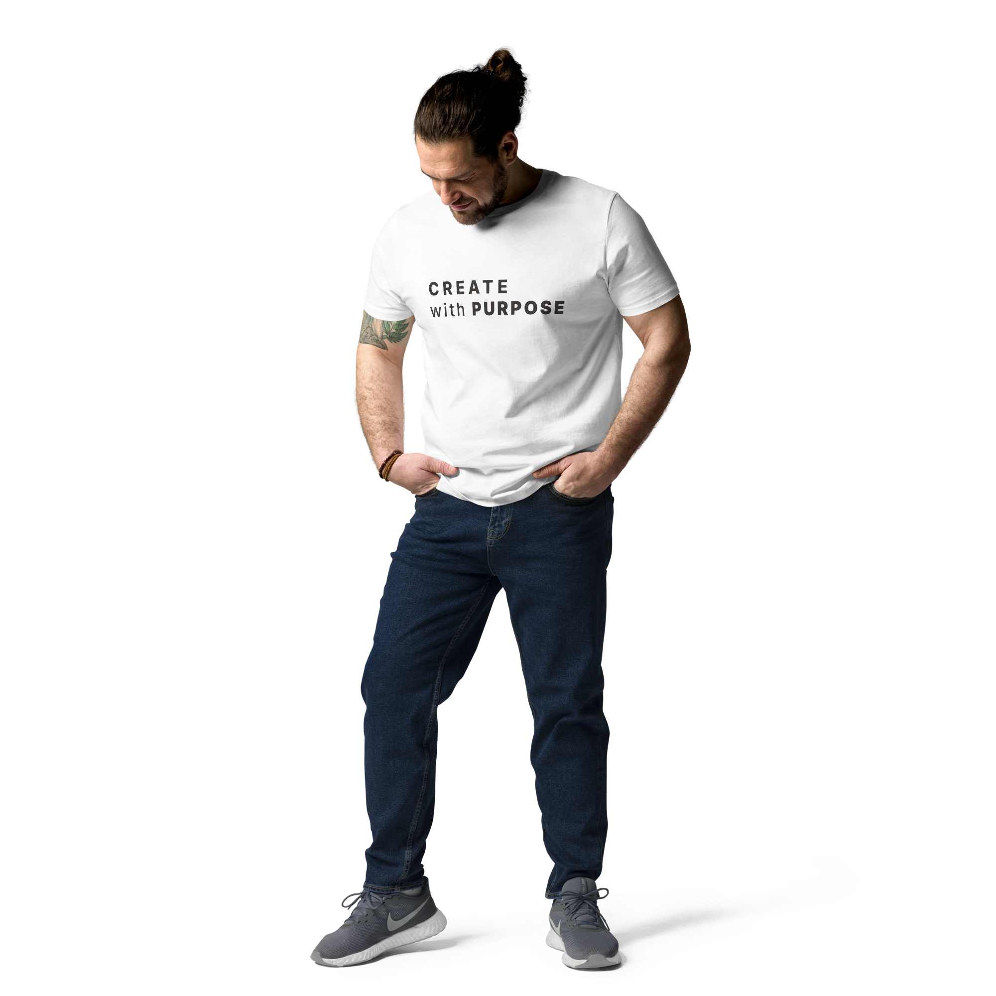 White organic cotton t-shirt lifestyle photo of man wearing “CREATE with PURPOSE”