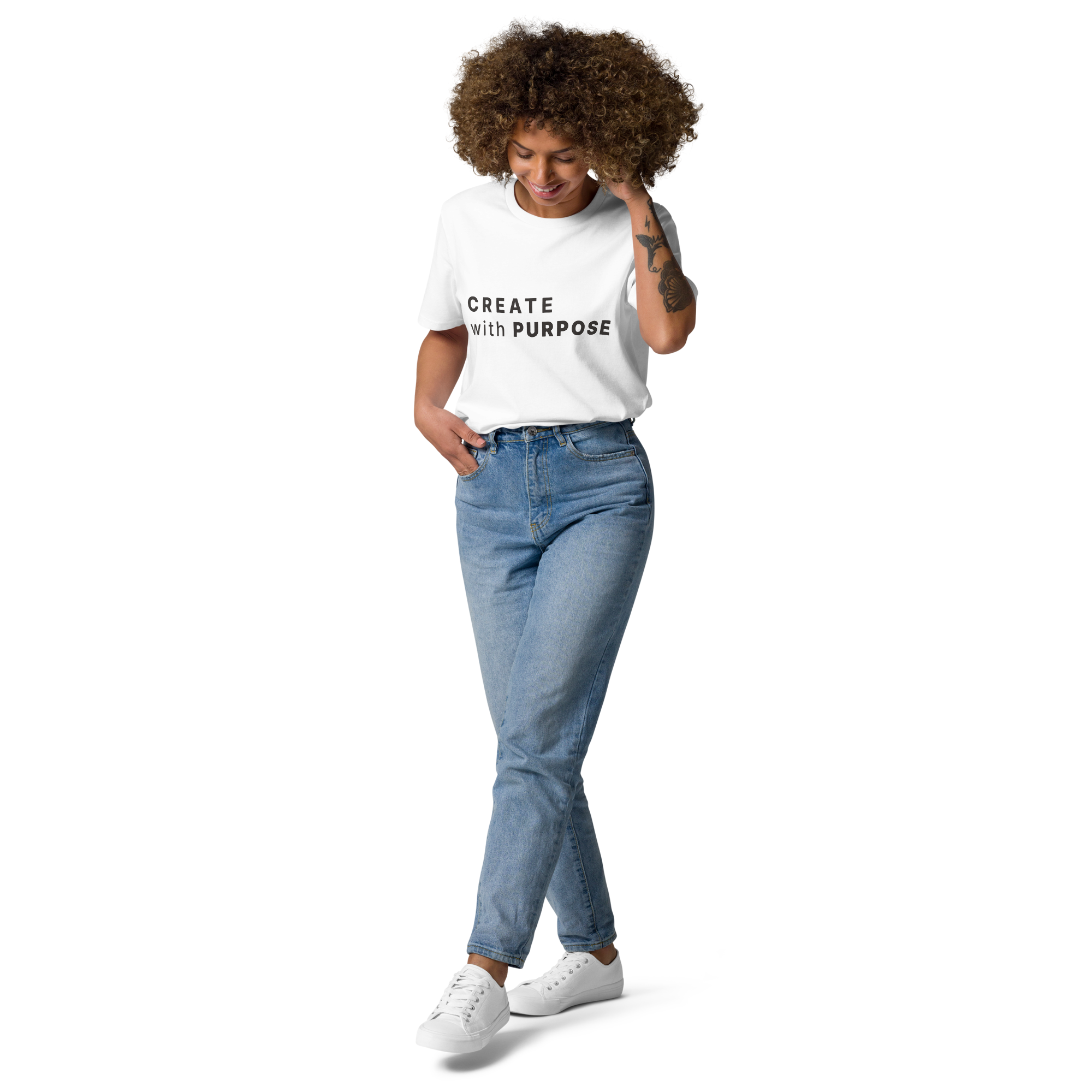 White organic cotton t-shirt lifestyle photo of woman wearing “CREATE with PURPOSE”
